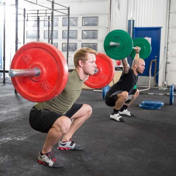 Two men working out at the gym